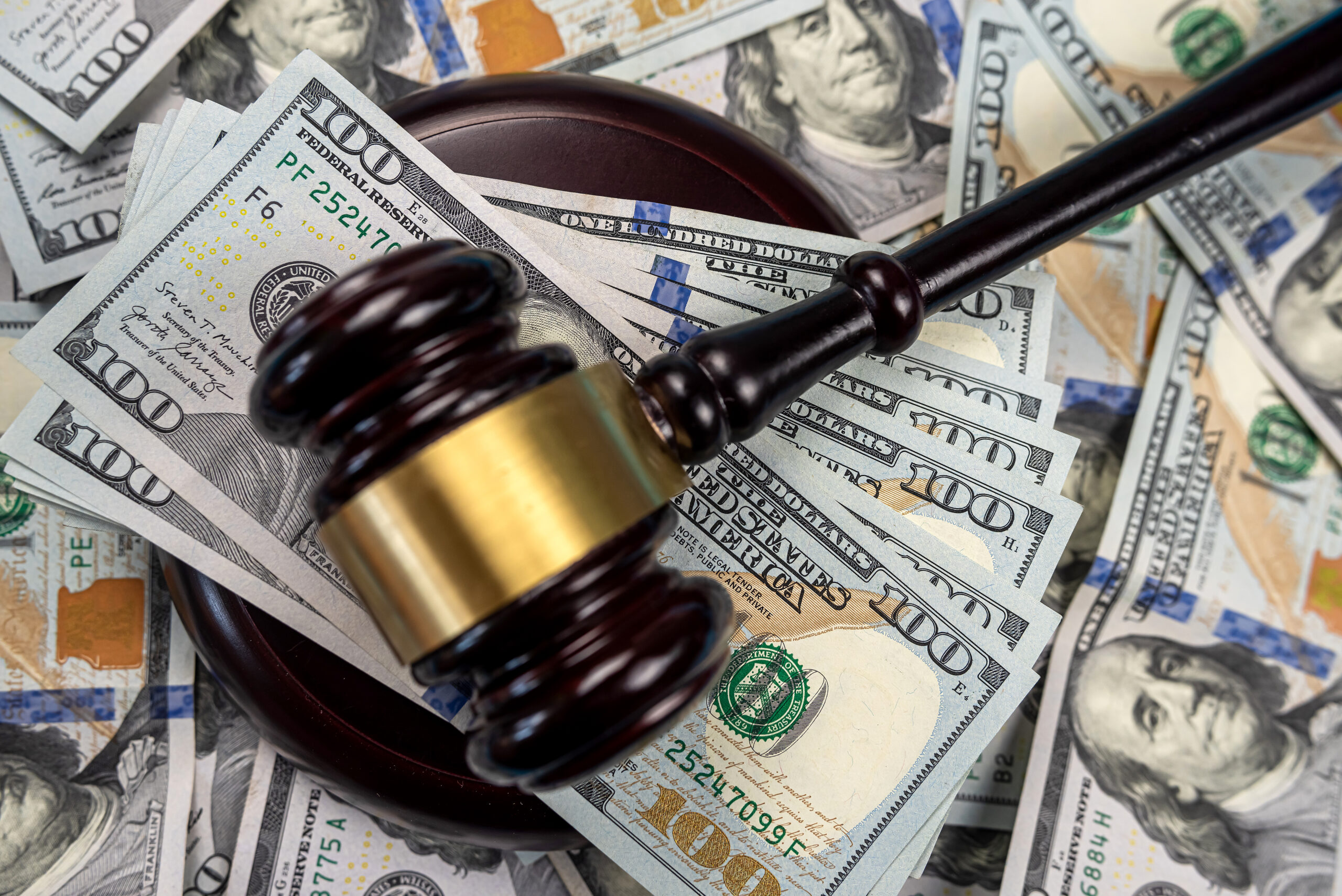 missouri personal injury compensation - gavel on top of a pile of money