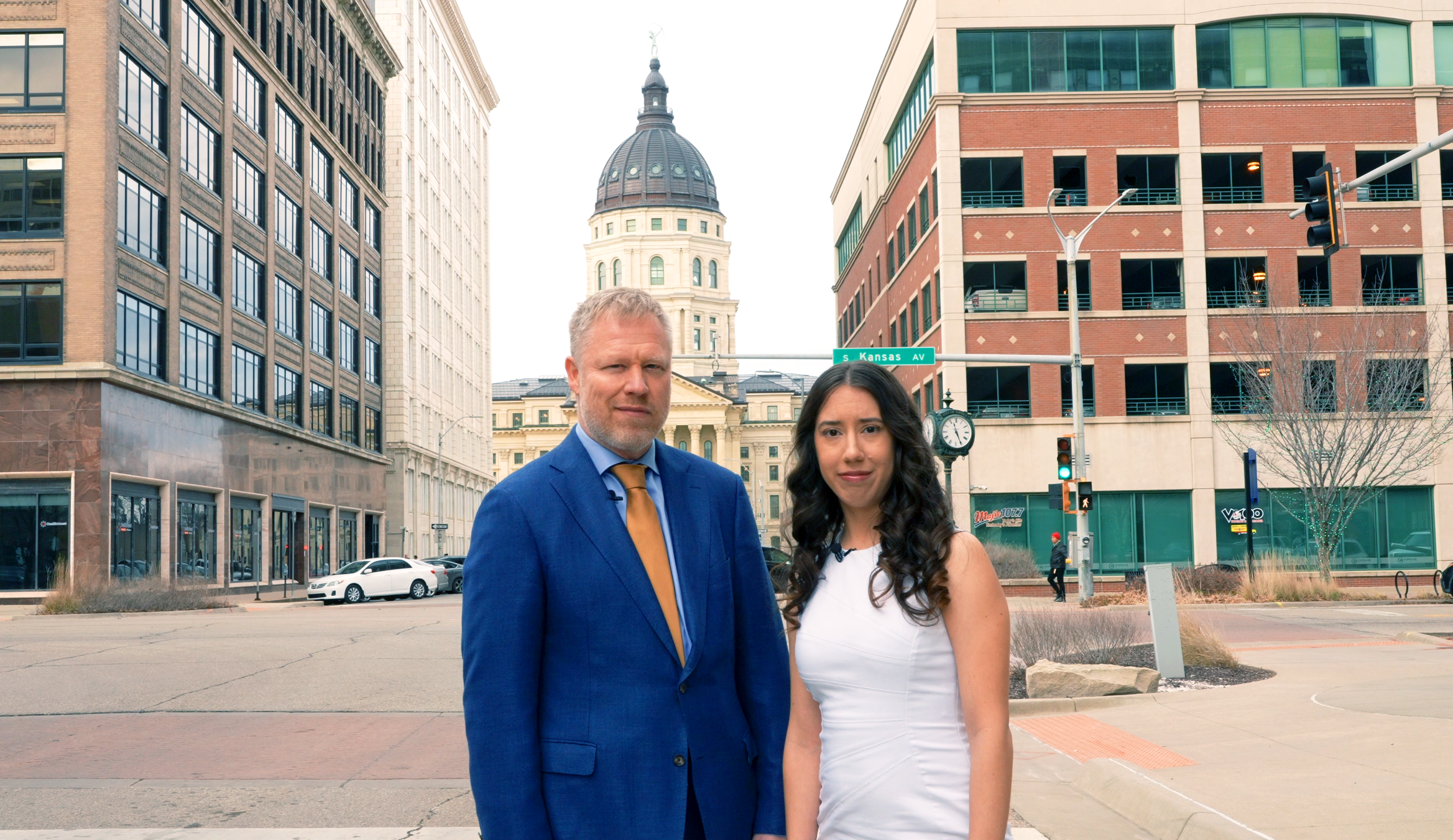 attorneys Jerry Wallentine and Tess Ramirez stand in front of Topeka, Kansas capital